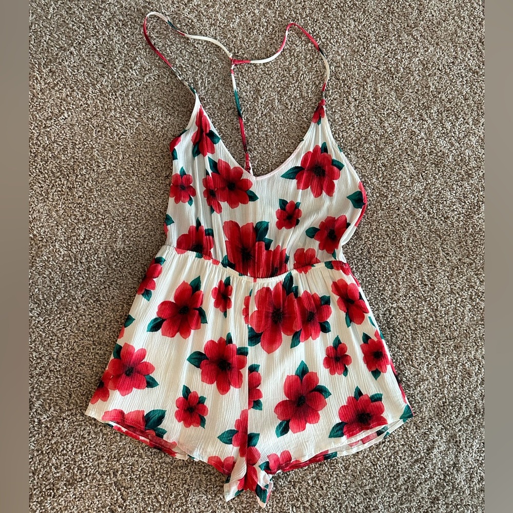 Super cute open back floral romper